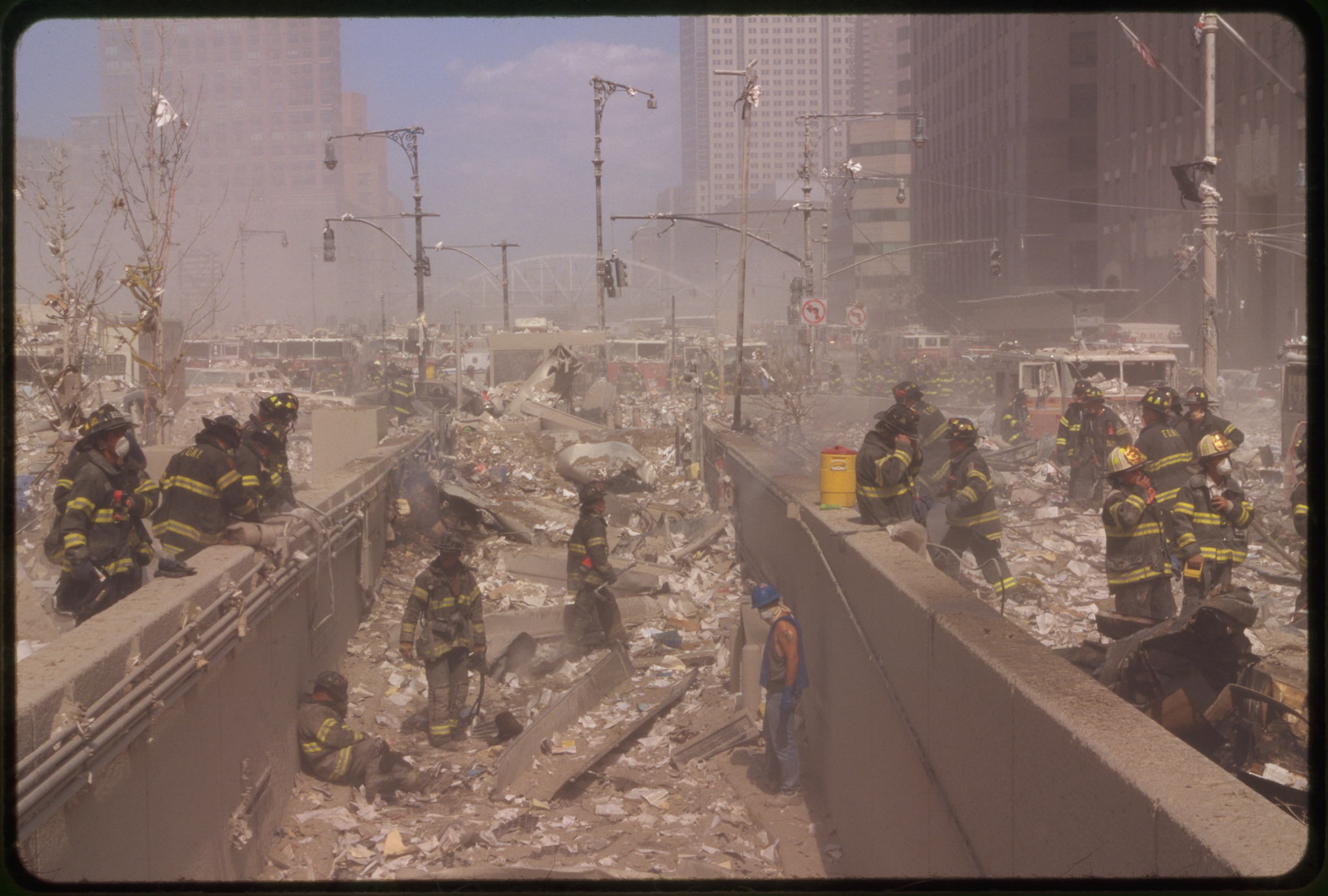 Rescue workers amid debris following September 11th terrorist attack on World Trade Center, New York City