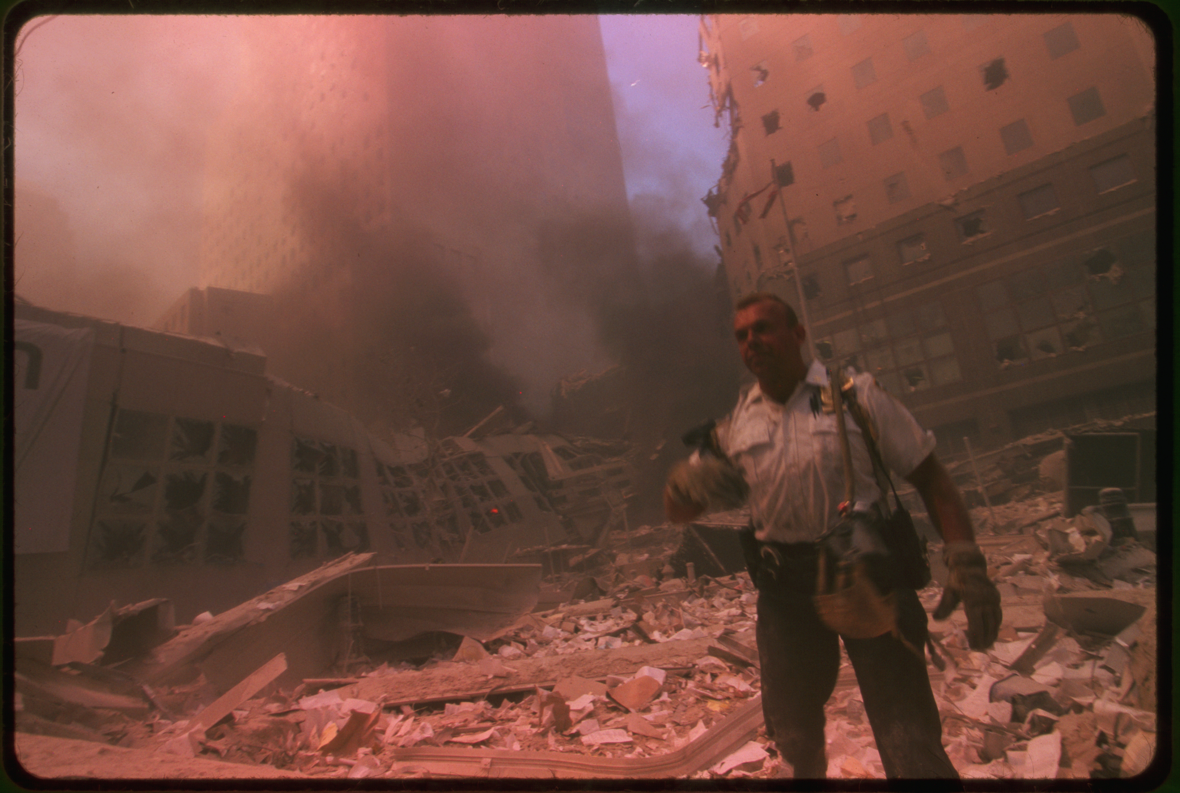 Rescue worker amid ruins following September 11th terrorist attack on World Trade Center, New York City