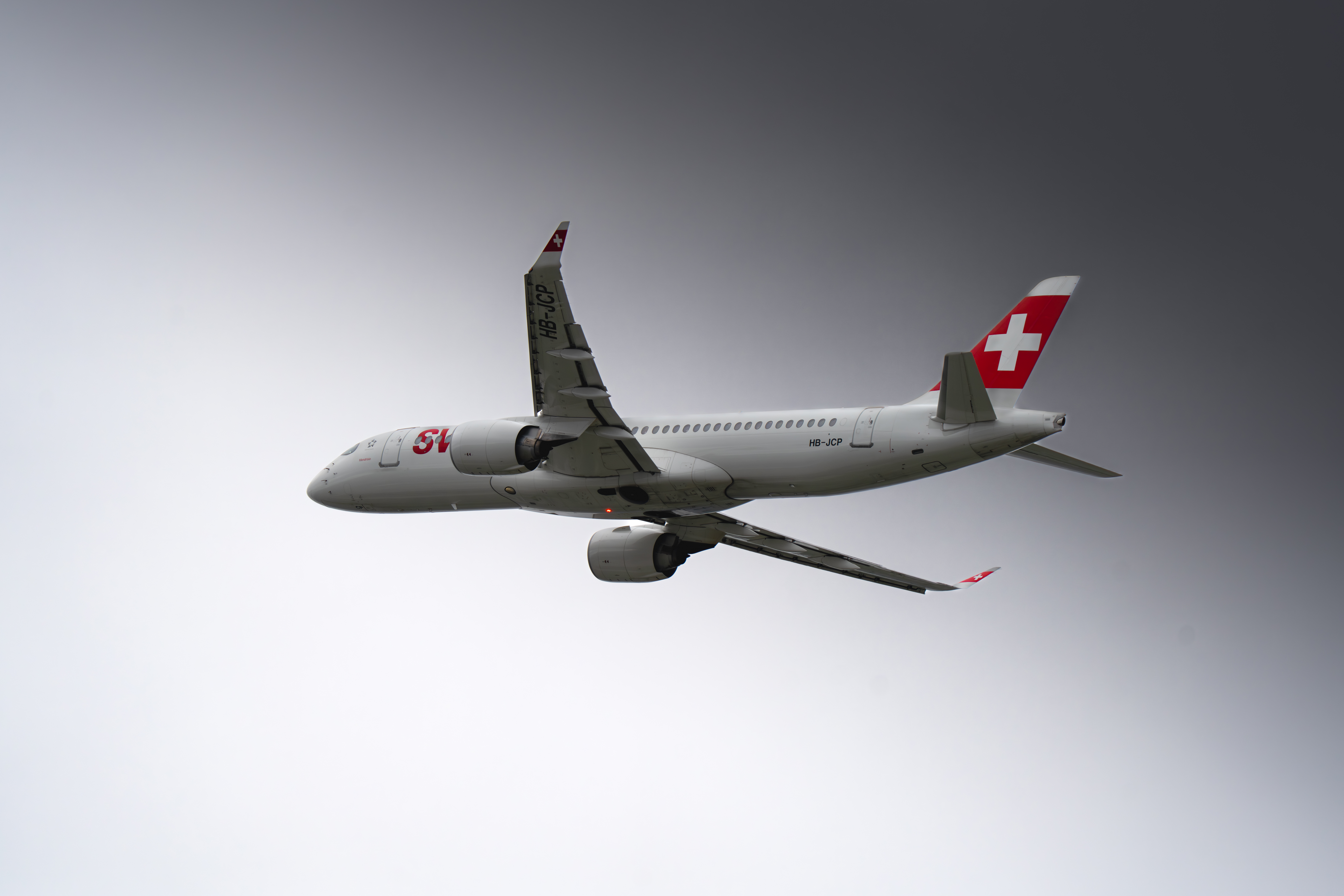 Airplane in the sky of geneva